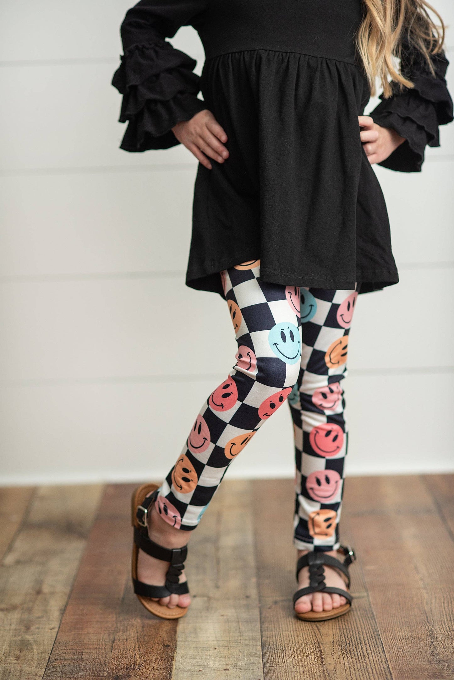 Kids Black & White Check Smiley Face Ruffle Top Leggings Set